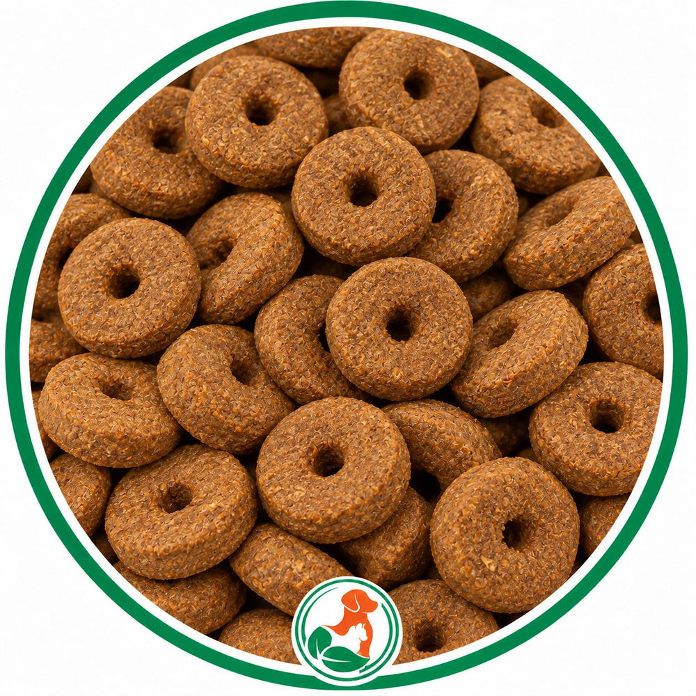 Brown, ring-shaped Carrot Crunch Rounds dog treats with center holes in a green-bordered circle.