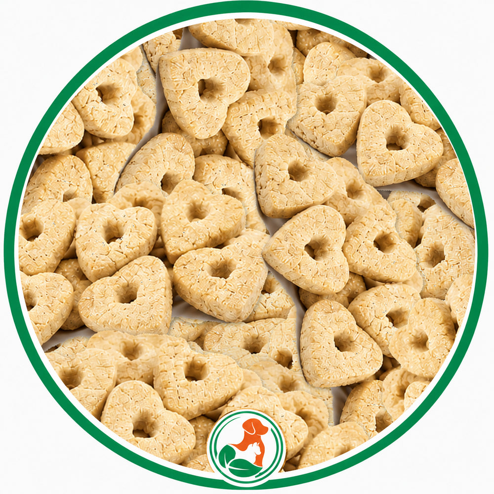 Pale Confetti Hearts dog treats with small center holes in a green-bordered circular close-up.