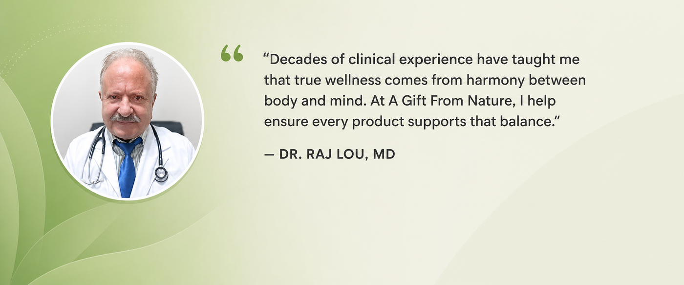 Dr. Raj Lou in a white coat and stethoscope in an A Gift From Nature branded consultation office