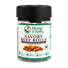 A bottle of Hemp & Tails Savory Beef Rolls dog treats on a plain white background. The product is in a clear plastic jar with a black ribbed cap and a white label featuring green and brown text and graphics.